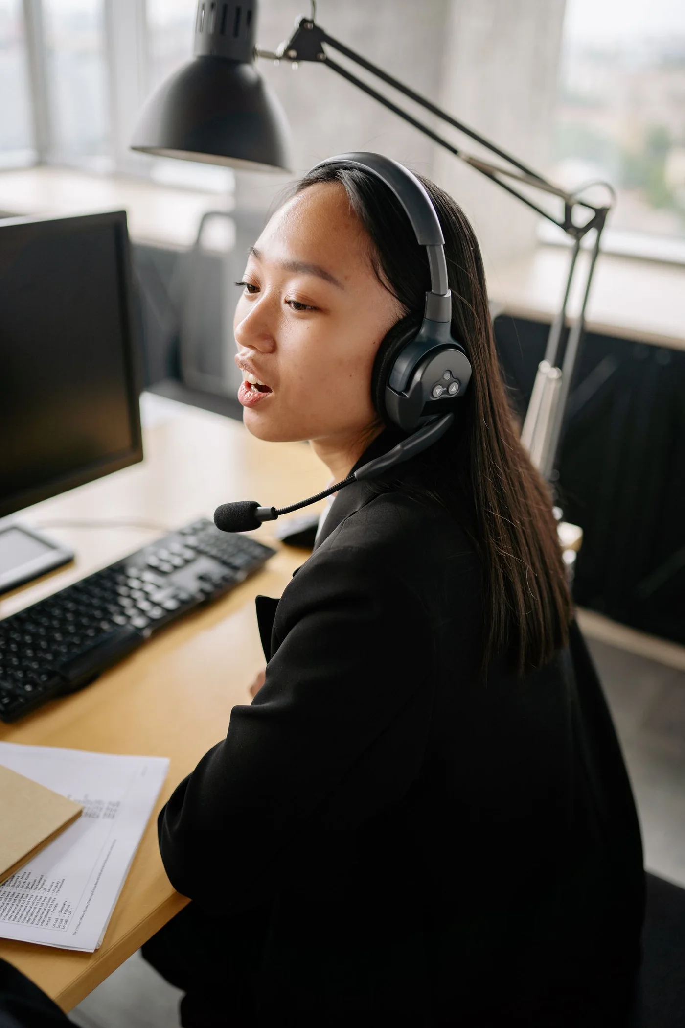 A woman providing support through a headset.
